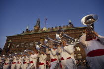 Brass band performing at open air concert outside the Radhus.Colorful Town Hall  Danish Danmark European Northern Europe Scandinavia