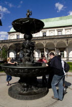 Tourists at The Singing Fountain in front of the Belvedere or Royal Summer Palace in the Italian Renaissance style built by King Ferdinand I for his wife AnnePraha Ceska Eastern Europe European