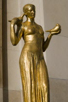 Gilded bronze statue of a woman with doves in the central square of the Palais Chaillot beside TrocaderoEuropean French Western Europe