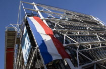 Large French tricolour flag flying from the George Pompidou centre in Beauborg Les HallesCenter European Western Europe