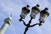 Place Vendome Ornate lamp post and statue of Napoleon on the top of a column modelled on Trajans column in RomeEuropean French Roma Western Europe