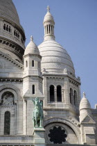 Montmartre The facade of the church of Sacre Couer with the bronze equestrian statue of Joan of ArcEuropean French Religion Western Europe