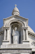 Montmartre The statue of Christ in the centre of the facade of the church of Sacre CouerCenter European French Religion Western Europe