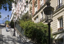 Montmartre Woman walking down steps from the church of Sacre Couer to Rue Paul AlbertEuropean French Western Europe