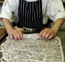 Chef making pork sausages with coalFresh  food  sausages Great Britain UK United Kingdom