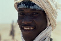 Mauretanian man smiling to show gold front tooth.