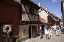 Tourists walking along Golden Lane in Prague Caslte lined with artisan shopsPraha Ceska Eastern Europe European
