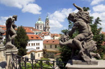 The Vrtba Gardens in the Little Quarter with the Baroque Church of St Nicholas beyond. Statues of Classical Gods by the Artist Matthias Braun in the foregroundPraha Ceska Eastern Europe European Reli...
