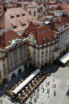 Rooftops and rooftop restaurant with pavement cafes below in the Old Town SquarePraha Ceska Eastern Europe European