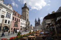 Open air restaurants lining the street leading past the Old Town Hall towards the Square with the Church of Our Lady before Tyn at the far endPraha Ceska Eastern Europe European Religion