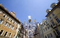 Ornate railings around a fountain in Namesti Square with Hotel Rott to the left. Formerly U Rott an ironmongers shop decorated with colourful paintings by the 19th Century artist Mikulas Ales in the O...