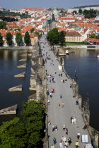 People walking on The Charles Bridge across the Vltava River leading to the Little QuarterPraha Ceska Eastern Europe European