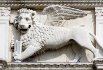 A stone carving of the winged Lion of St Mark  symbol of Venice  on the entrance to the Arsenal