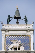 The 15th Century Torre dellOrogolio  Clock Tower  with the two bronze Mori  or Moors  who strike the bell on the hour. Below is the winged Lion of St Mark