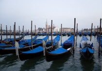 Gondolas moored by Molo San Marco with Palladios church of San Giorgio Maggiore beyond