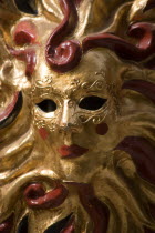 Close up of a golden carnival mask.