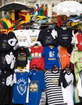 Souvenirs of T-shirts  hats and lace umbrellas for sale in Piazza San Marco