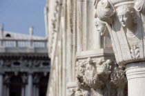 Carvings of female faces on columns of the Doges Palace