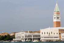 The Campanile in Piazza San Marco with the Doges Palace in the foreground seen from the Basin of St Mark