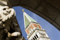 The Campanile tower in the Piazza San Marco seen through an arch of the Doges Palace