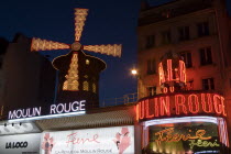 Montmartre The illuminated widmill and frontage of the Moulin Rouge nightclub in PigalleEuropean French Western Europe