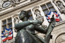 Bronze sculpture of a naked female in front of the Hotel de Ville or Town HallEuropean French Western Europe