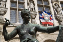 Bronze sculpture of a naked female in front of the Hotel de Ville or Town HallEuropean French Western Europe