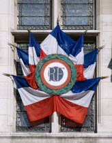 French Tricolour flags displayed in a window of the Hotel de Ville or Town HallEuropean Western Europe