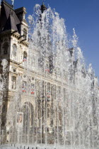 The Hotel de Ville or Town Hall seen through the water from a fountainEuropean French Western Europe