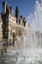 Tourists beside a fountain in front of the Hotel de Ville or Town HallEuropean French Western Europe