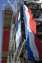 A large French Tricolour flag hanging from the Pompidou Centre in Beauborg Les HallesCenter European Western Europe