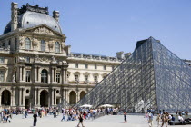 The centrepiece of the Richelieu wing of the Musee du Louvre with the Pyramid entrance crowded with tourists in the foregroundEuropean French Western Europe