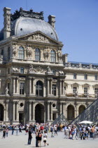 The centrepiece of the Richelieu wing of the Musee du Louvre with the Pyramid entrance crowded with tourists in the foregroundEuropean French Western Europe