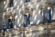 Statues on a balcony of the Denon wing of the Musee du LouvreEuropean French Western Europe