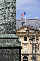 Monument to Naploeon in Place Vendome modelled on Trajans Column in Rome with the French Tricolour flag flying above the Ministry of Justice beyondEuropean Roma Western Europe