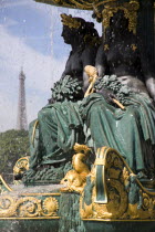 Ornate figures in a 19th Century fountain in the Place de la Concorde with the Eiffel Tower in the distanceEuropean French Western Europe