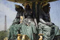 Ornate figures in a 19th Century fountain in the Place de la Concorde with the Eiffel Tower in the distanceEuropean French Western Europe