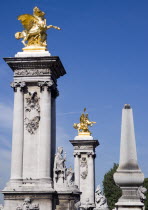 Gilded statues on columns at the entrance to the Pont Alexandre III bridgeEuropean French Western Europe