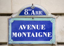 Street sign on a wall for Avenue Montaigne in the Huitieme Arrondissement. The centre of the couture fashion industryCenter European French Western Europe