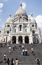 Montmartre The Facade of the church of Sacre Couer with tourists on the steps leading up to itEuropean French Religion Western Europe