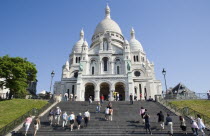 Montmartre Steps filled with tourists leading up to the front of the church of Sacre CouerEuropean French Religion Western Europe