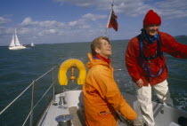 Female crew on yacht preparing for trans-Atlantic race.European Great Britain Northern Europe UK United Kingdom