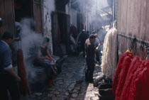 Street scene in area of wool dyers with skeins of coloured wool hanging up to dry.African al-Magrib Colored Fes Moroccan North Africa Fez African al-Magrib Colored Fes Moroccan North Africa Fez