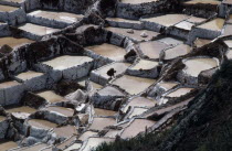 Female worker on salt terraces.Cusco American Cuzco Peruvian South America Hispanic Latin America Latino Cusco American Cuzco Peruvian South America Hispanic Latin America Latino