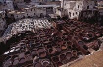 Chouwara Tanneries.  Elevated view over the tanner s pits with city buildings beyond.Fez African al-Magrib Fes Moroccan North Africa  Fez African al-Magrib Fes Moroccan North Africa