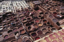 Chouwara Tanneries.  Elevated view over men working in the tanner s pits.Fez African al-Magrib Fes Moroccan North Africa  Fez African al-Magrib Fes Moroccan North Africa