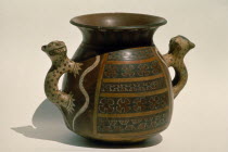 Inca ceremonial ceramic vessel with handles carved in the form of jaguars.