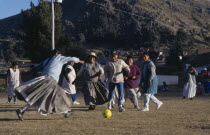 Local women playing football.American Bolivian South America Hispanic Latin America Latino American Bolivian South America Hispanic Latin America Latino
