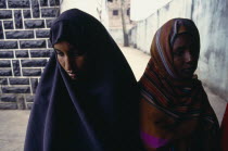 Two Somali women with covered heads.African Eastern Africa Kenyan  African Eastern Africa Kenyan