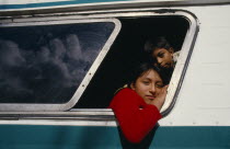 Guatemalan refugee children looking out of bus window. American Kids Mexican Hispanic Latin America Latino American Kids Mexican Hispanic Latin America Latino